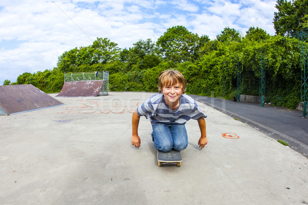 boy has fun riding on the skate board Stock photo © meinzahn