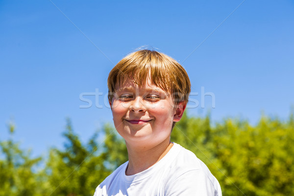 happy boy is smiling and closes eyes Stock photo © meinzahn