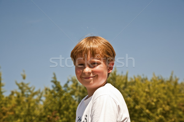 happy boy is smiling and enjoying life Stock photo © meinzahn