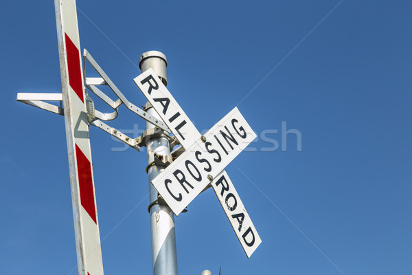 Stock photo: Railroad warning crossing sign under blue sky
