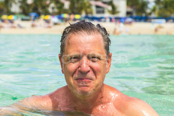 handsome man has fun swimming in the ocean Stock photo © meinzahn