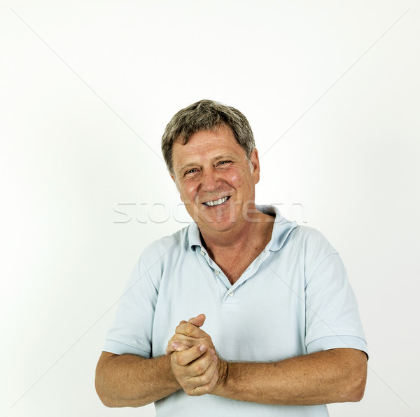 handsome smiling man in blue leisure polo shirt  Stock photo © meinzahn