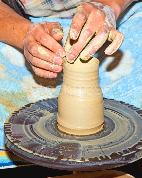 hands working on pottery wheel  Stock photo © meinzahn
