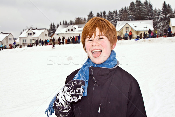 boy with red hair enjoying   the snow  Stock photo © meinzahn