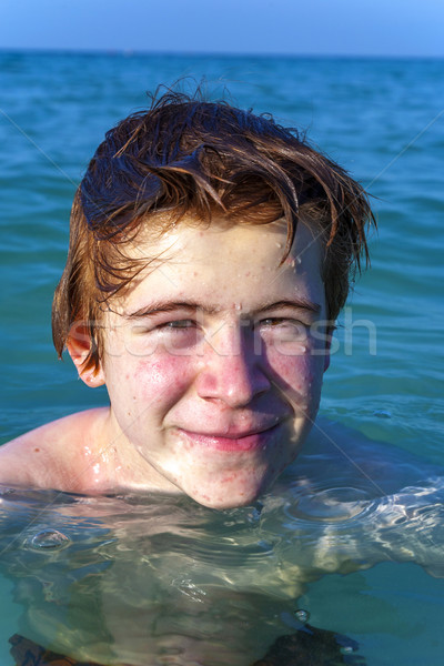 boy with red hair is enjoyingthe ocean Stock photo © meinzahn