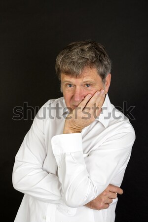 mature man in white business shirt looking snotty Stock photo © meinzahn