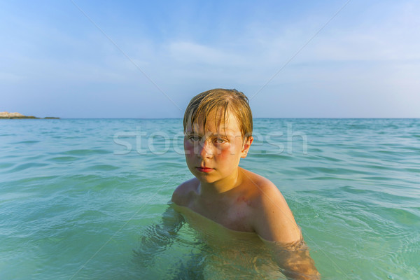 angry young boy in the beautiful ocean Stock photo © meinzahn