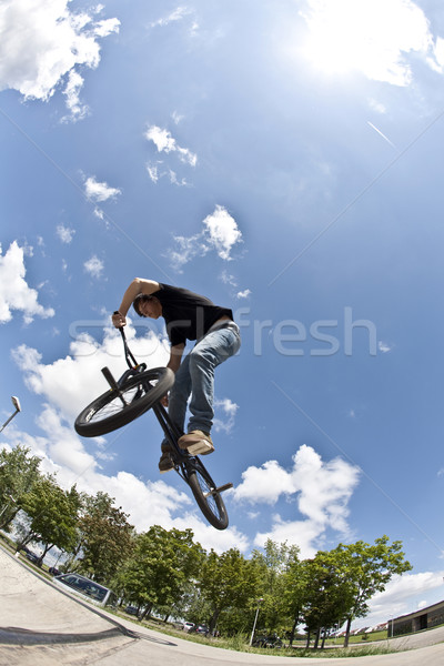 boy has fun with dirt bike in the skate park Stock photo © meinzahn