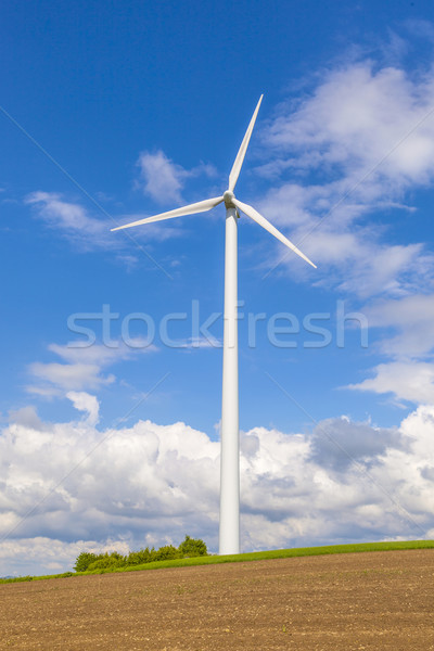 wind turbine generating electricity on blue sky  Stock photo © meinzahn