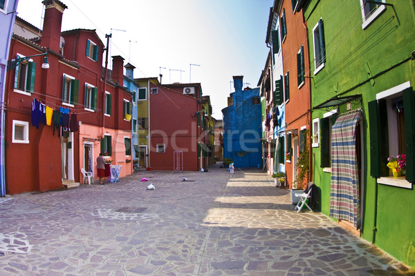 colorful facade of an old fisher house and street in the village Stock photo © meinzahn