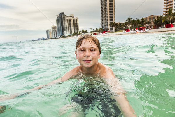 Stock photo: child is swimming in the ocean