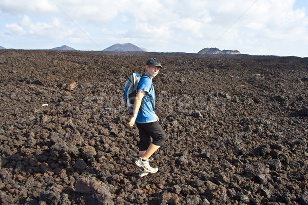 boy on walking trail in volcanic area in Lanzarote Stock photo © meinzahn