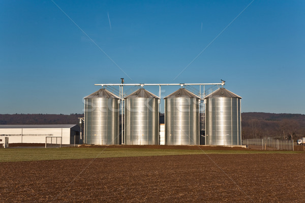 beautiful landscape with silo and field with blue sky Stock photo © meinzahn
