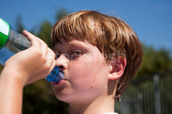 Fiú izzadás italok ásványvíz sportok ki Stock fotó © meinzahn