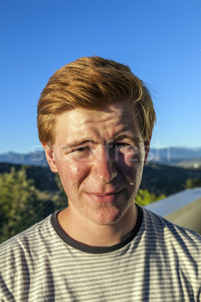 portrait of handsome boy with red hair under blue sky Stock photo © meinzahn