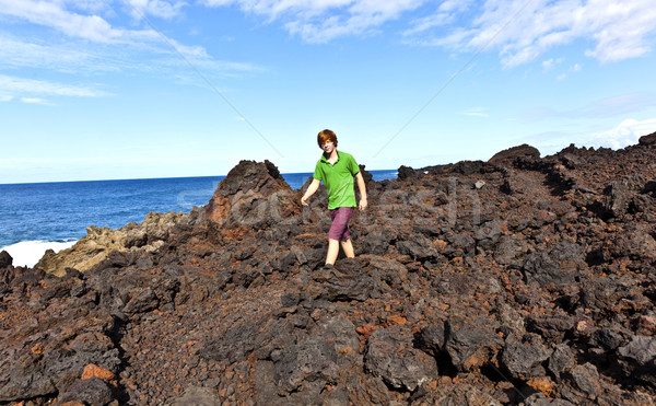 boy walking in volcanic area Stock photo © meinzahn