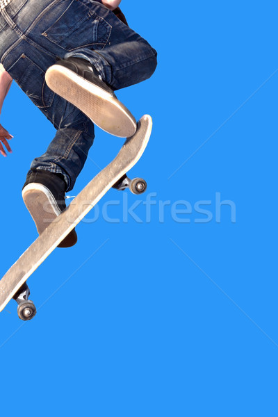 Stock photo: skate board going airborne