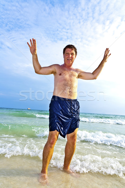 man enjoys the beautiful sandy beach Stock photo © meinzahn