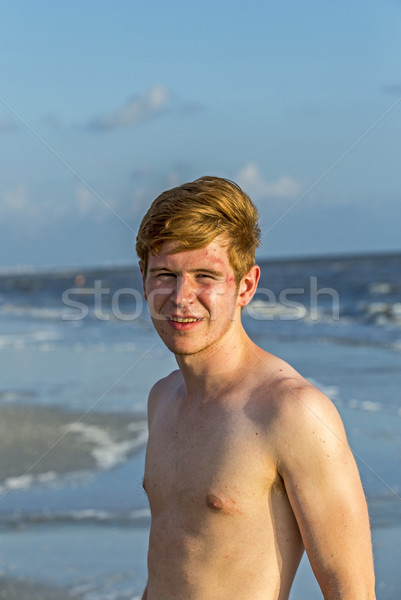 handsome confident teenager in sunset at the beach Stock photo © meinzahn