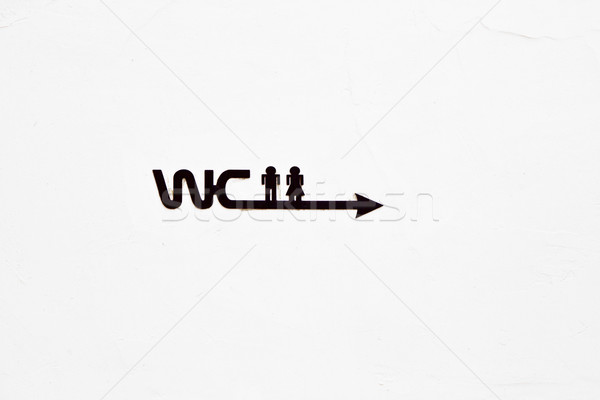 sign WC with icon of Man and woman on the concrete wall  Stock photo © meinzahn