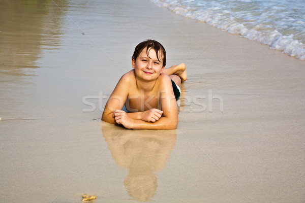 happy young boy enjoys the beach Stock photo © meinzahn