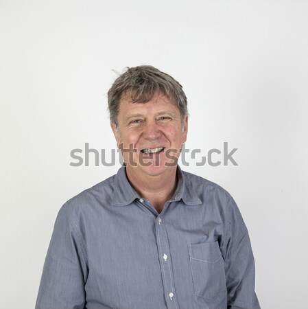 Mosolyog érett férfi szürke pólóing portré arc Stock fotó © meinzahn
