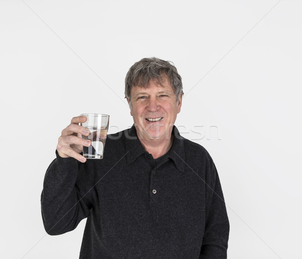 Stock photo: portrait of cool looking handsome man drinking a glass of water