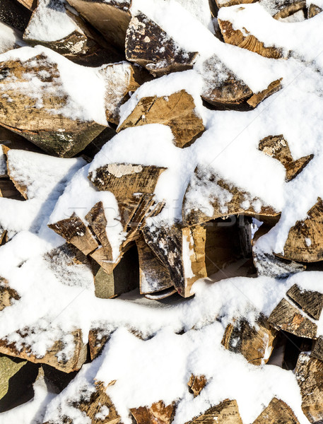 Stock photo: pile of chopped wood stacked in  winter