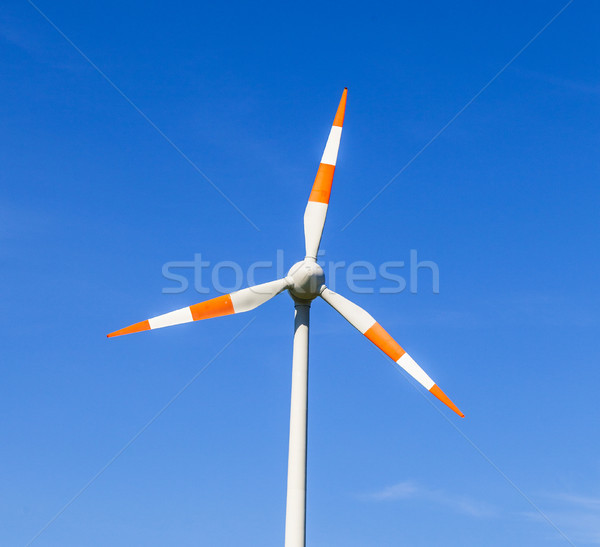 Windmill gathers energy from the summer breeze.  Stock photo © meinzahn