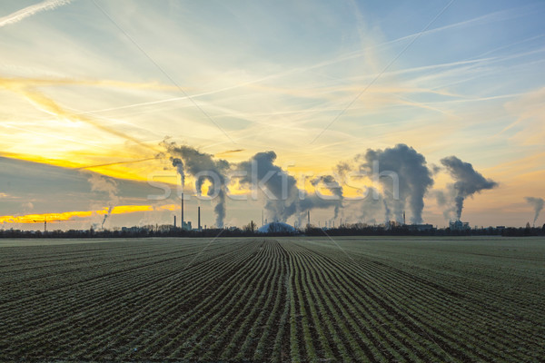 Humo industria planta campos amanecer nubes Foto stock © meinzahn