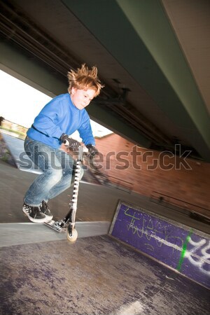 child on his scooter speeding down the ramp Stock photo © meinzahn