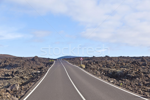 street through volcanic area in Timanfaya national park Stock photo © meinzahn
