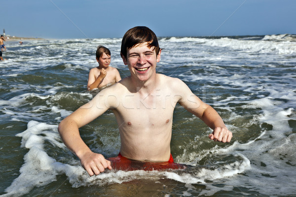boy enjoying the beautiful ocean and beach Stock photo © meinzahn