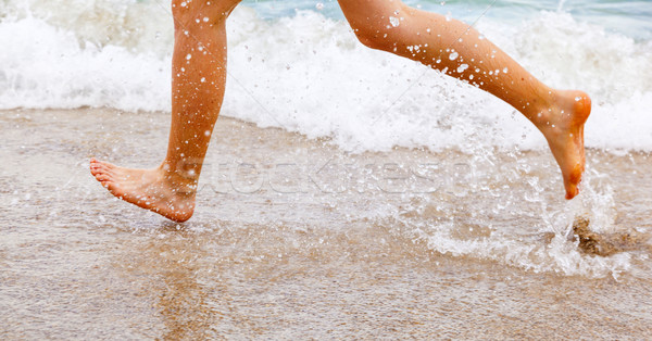 Ayaklar erkek çalışma plaj su güneş Stok fotoğraf © meinzahn