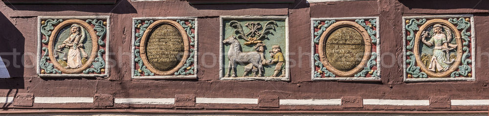 traditional carving at an half timbered house with symbols  Stock photo © meinzahn