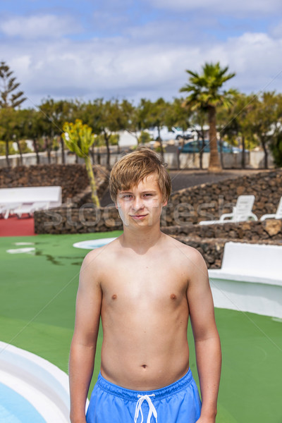 walking boy in a pool area  Stock photo © meinzahn