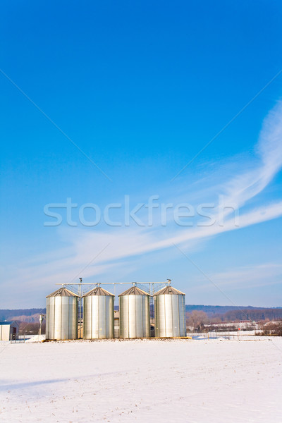 beautiful landscape with silo and snow white acre with blue sky Stock photo © meinzahn