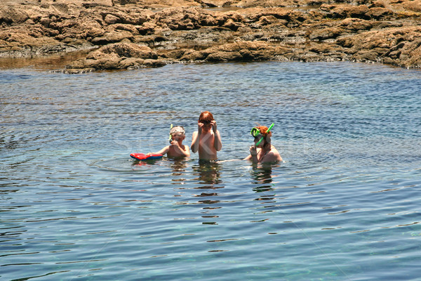 people snorkeling in a natural basin in Lanzarote Stock photo © meinzahn