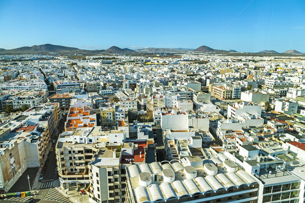 aerial of Arrecife with volcanoes at the horizon Stock photo © meinzahn