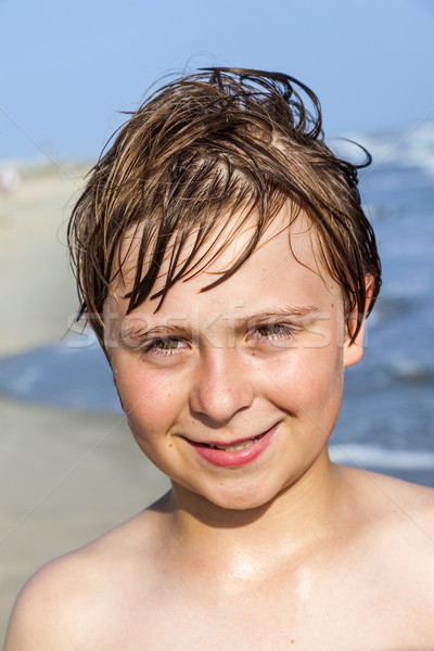 happy boy with wet hair at the beach Stock photo © meinzahn