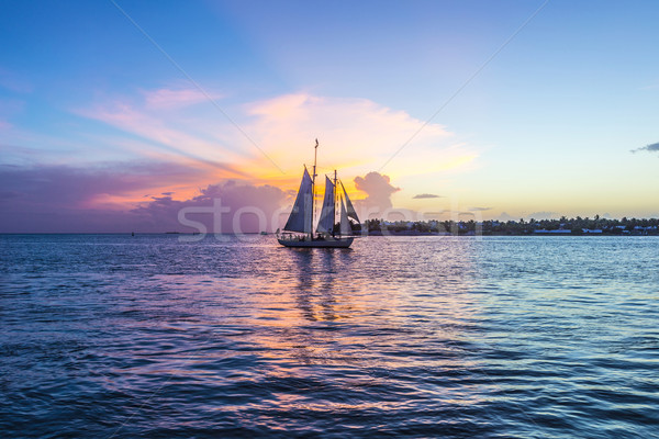 Pôr do sol chave ocidente navegação barco brilhante Foto stock © meinzahn