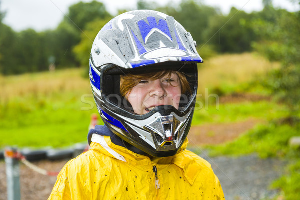 happy boy with helmet at the kart trail Stock photo © meinzahn
