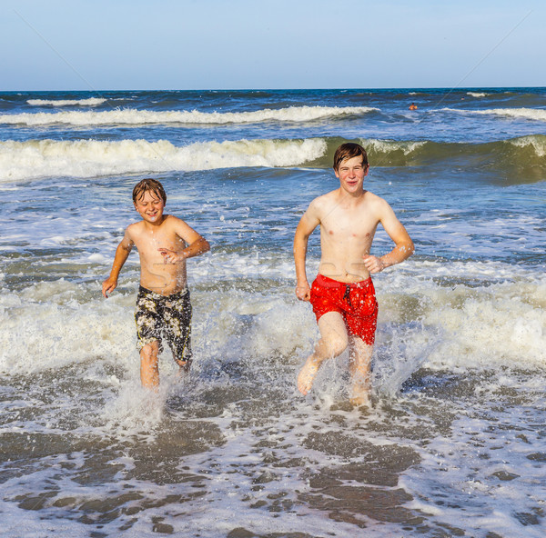 boys have fun in the beautiful clear sea Stock photo © meinzahn