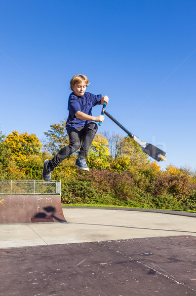 child going airborne with  scooter Stock photo © meinzahn