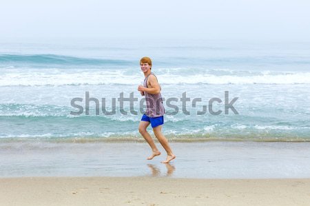 Fiatal srác tengerpart vonzó víz mosoly boldog Stock fotó © meinzahn