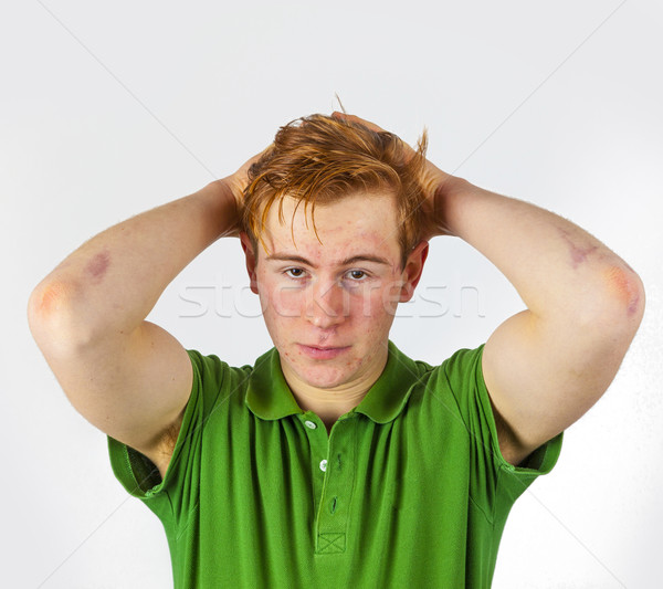 cool boy in green shirt with red hair Stock photo © meinzahn