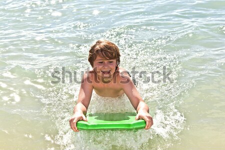 Ragazzo divertimento spiaggia tavola da surf sorriso bambini Foto d'archivio © meinzahn