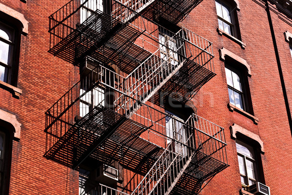 fire ladder at old houses downtown in New York Stock photo © meinzahn