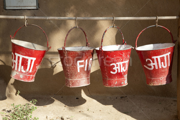 red fire buckets filled with sand  to protect in case of fire Stock photo © meinzahn
