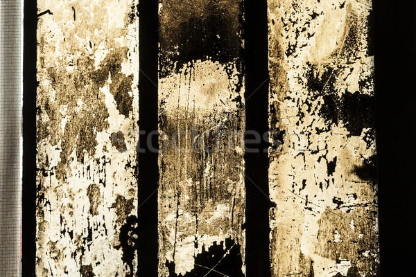 grungy window with carbon black symbolizes the dirt of iron work Stock photo © meinzahn